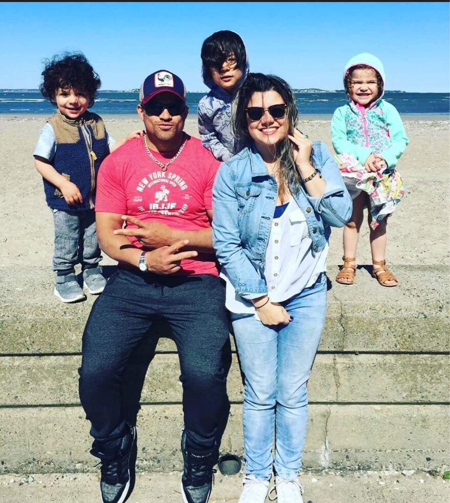 The Gomes family together on the beach
